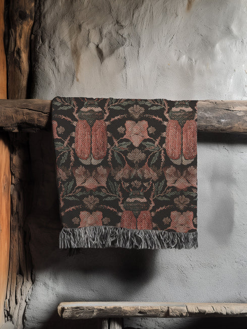 Luxurious woven cotton throw blanket featuring symmetrical scarab beetle pattern in terracotta on black background with white fringe detail. Perfect as gothic wall tapestry, dark academia decor, or cottagecore blanket for bedroom or living room.